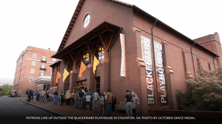 Patrons line up outside the Blackfriars Playhouse in Staunton, Virginia, waiting to attend a live performance at the American Shakespeare Center. Caption reads:Patrons line up outside the Blackfriars Playhouse in Staunton, VA. Photo by October Grace Media.