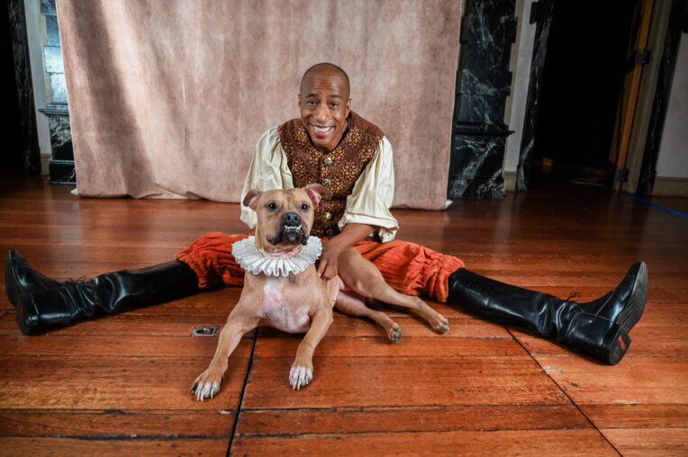 Actor GEOFFREY WARREN BARNES II AS LAUNCE and Maple Patterson (a Staffordshire-Terrier/Bulldog Mix, a former resuce dog adopted in 2021 from the Humane Society in Savannah, Georgia) as Crab in ASC’s The Two Gentlemen of Verona, 2025 at the Blackfriars Playhouse in Staunton, Virginia. Photo by Madison Patterson.